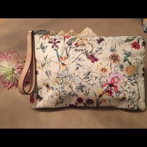 Carlos Santana large wristlet bag.